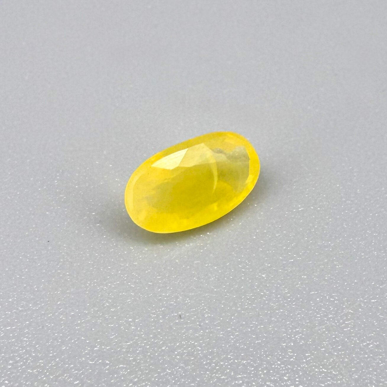 0.84 ct natural yellow opal from Africa, polished gemstone.
