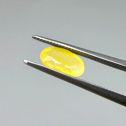 0.84 ct natural yellow opal from Africa, polished gemstone.