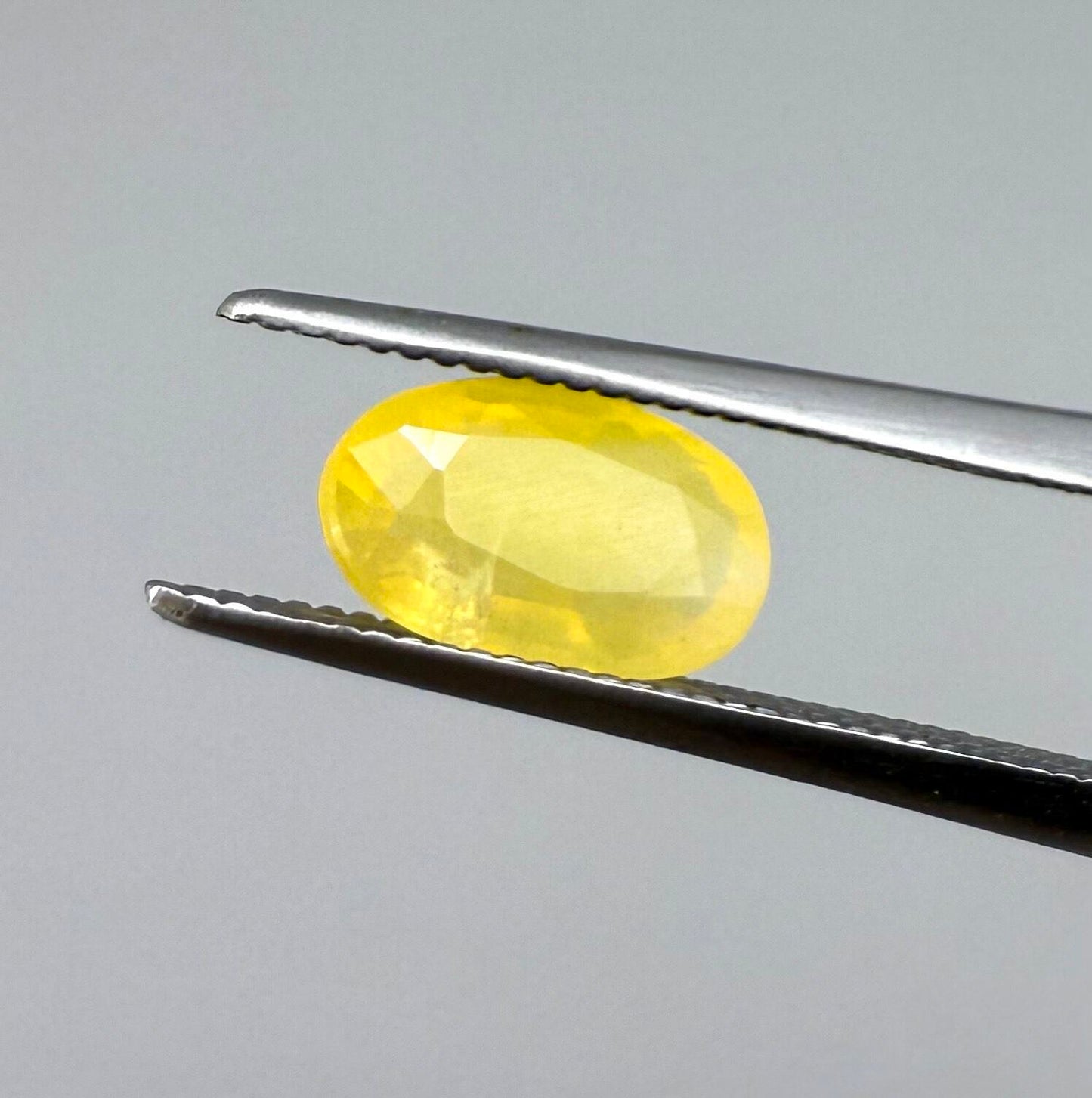 0.84 ct natural yellow opal from Africa, polished gemstone.