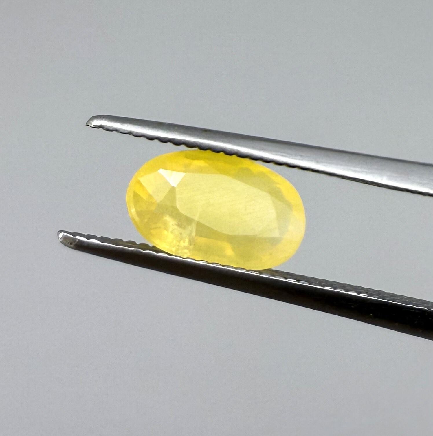 0.84 ct natural yellow opal from Africa, polished gemstone.