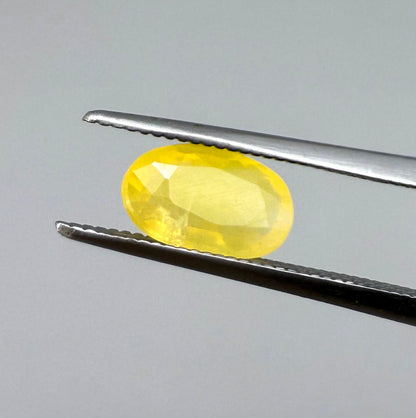 0.84 ct natural yellow opal from Africa, polished gemstone.