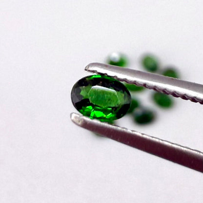 Lot of natural vibrant-green diopside stones, trillion cut, total weight 1.6 ct.