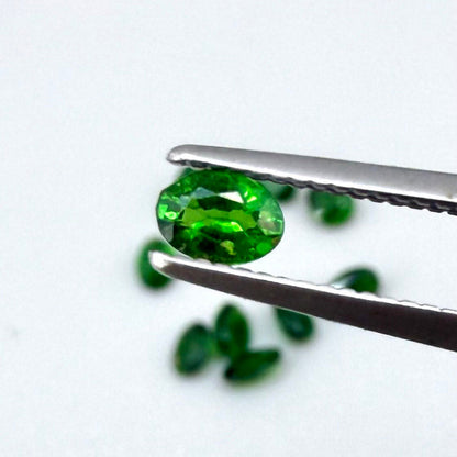 Lot of natural vibrant-green diopside stones, trillion cut, total weight 1.6 ct.