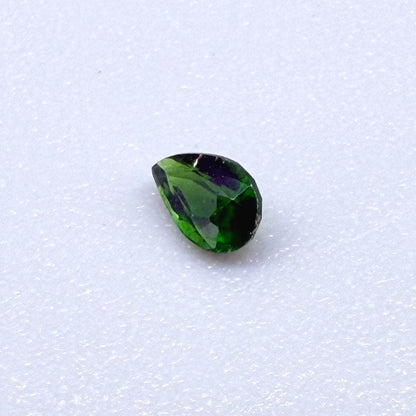 0.14 ct natural green diopside, pear cut.