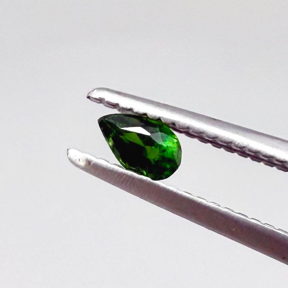 0.14 ct natural green diopside, pear cut.
