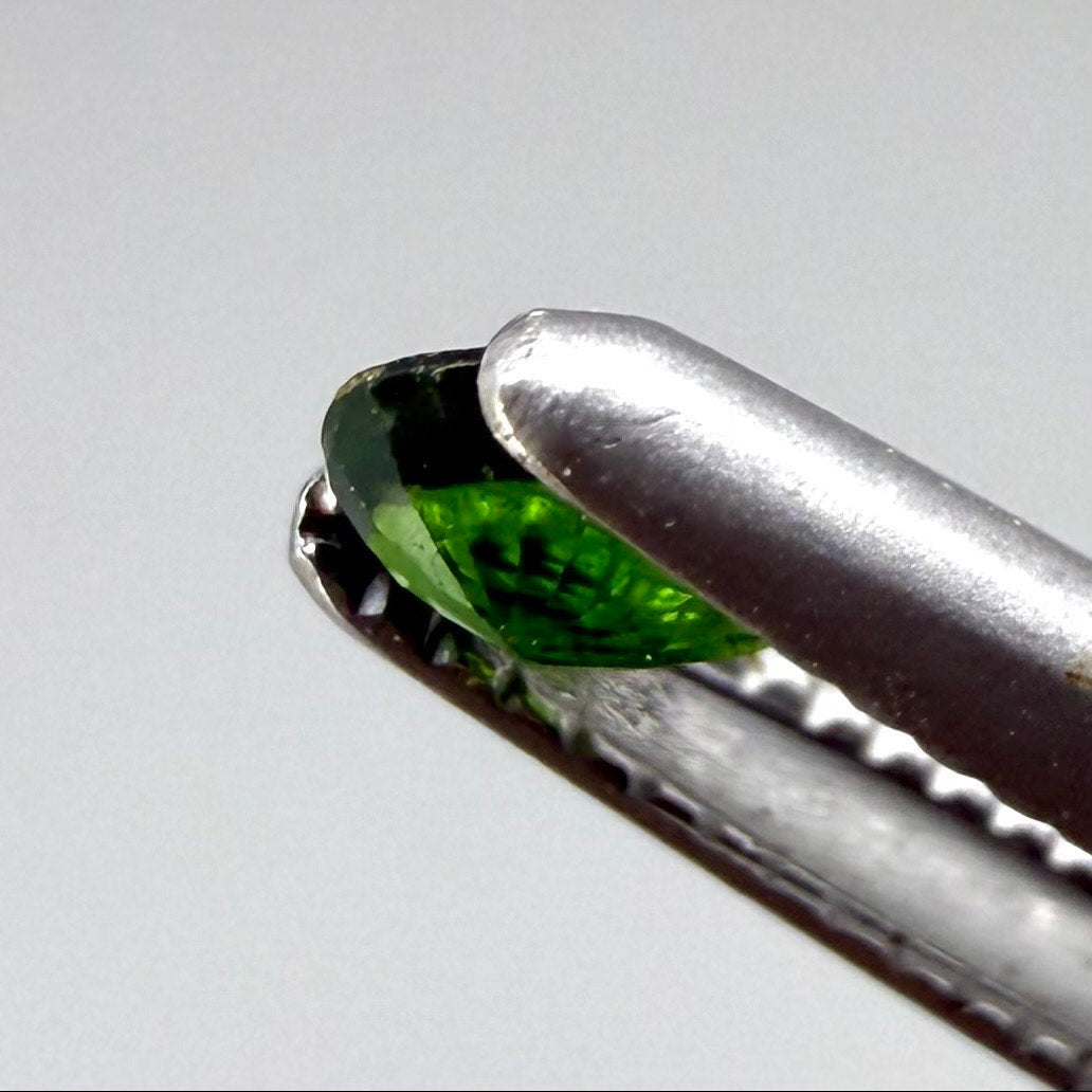 0.14 ct natural green diopside, pear cut.