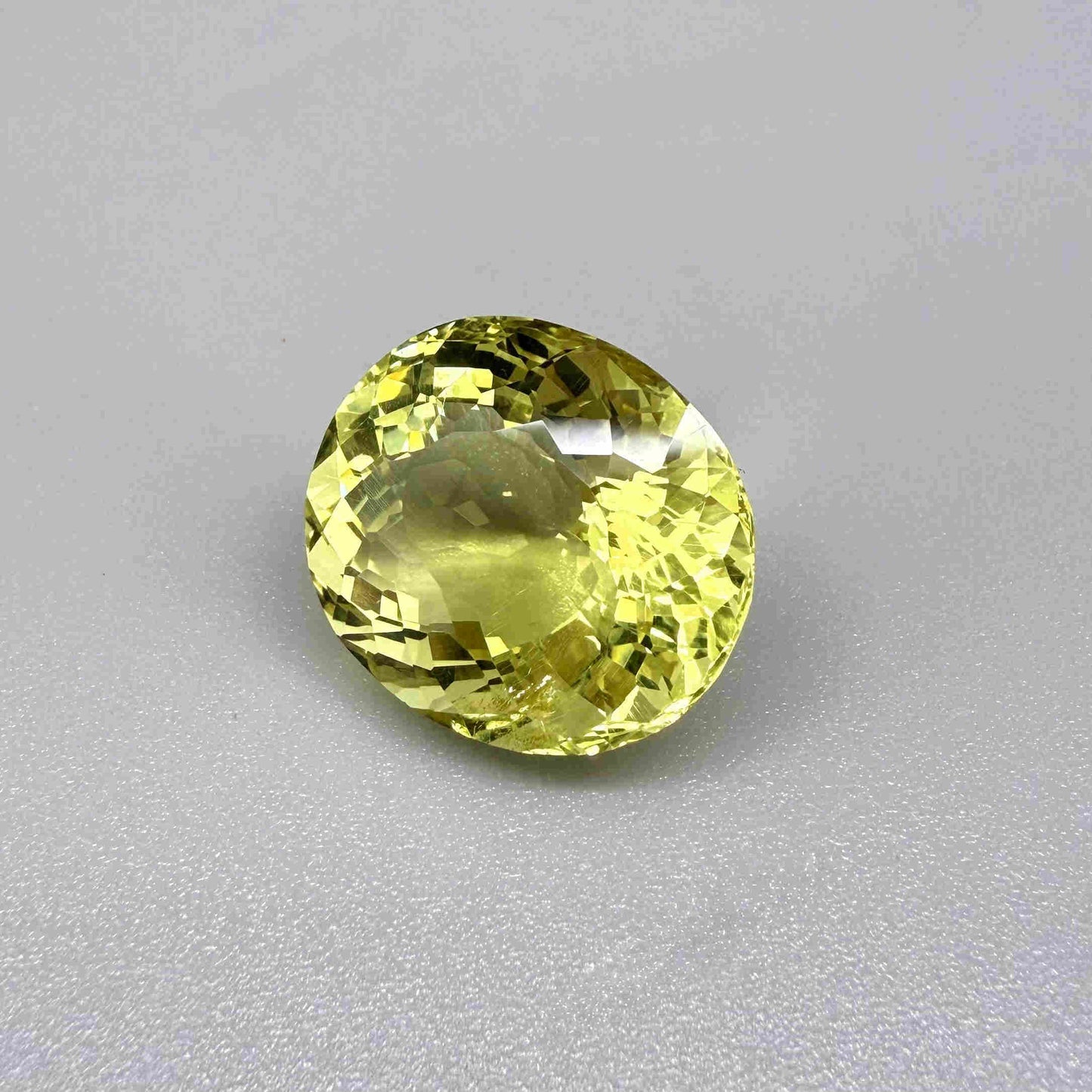 16.75 ct natural lemon quartz from Africa, oval cut with bright yellow color.