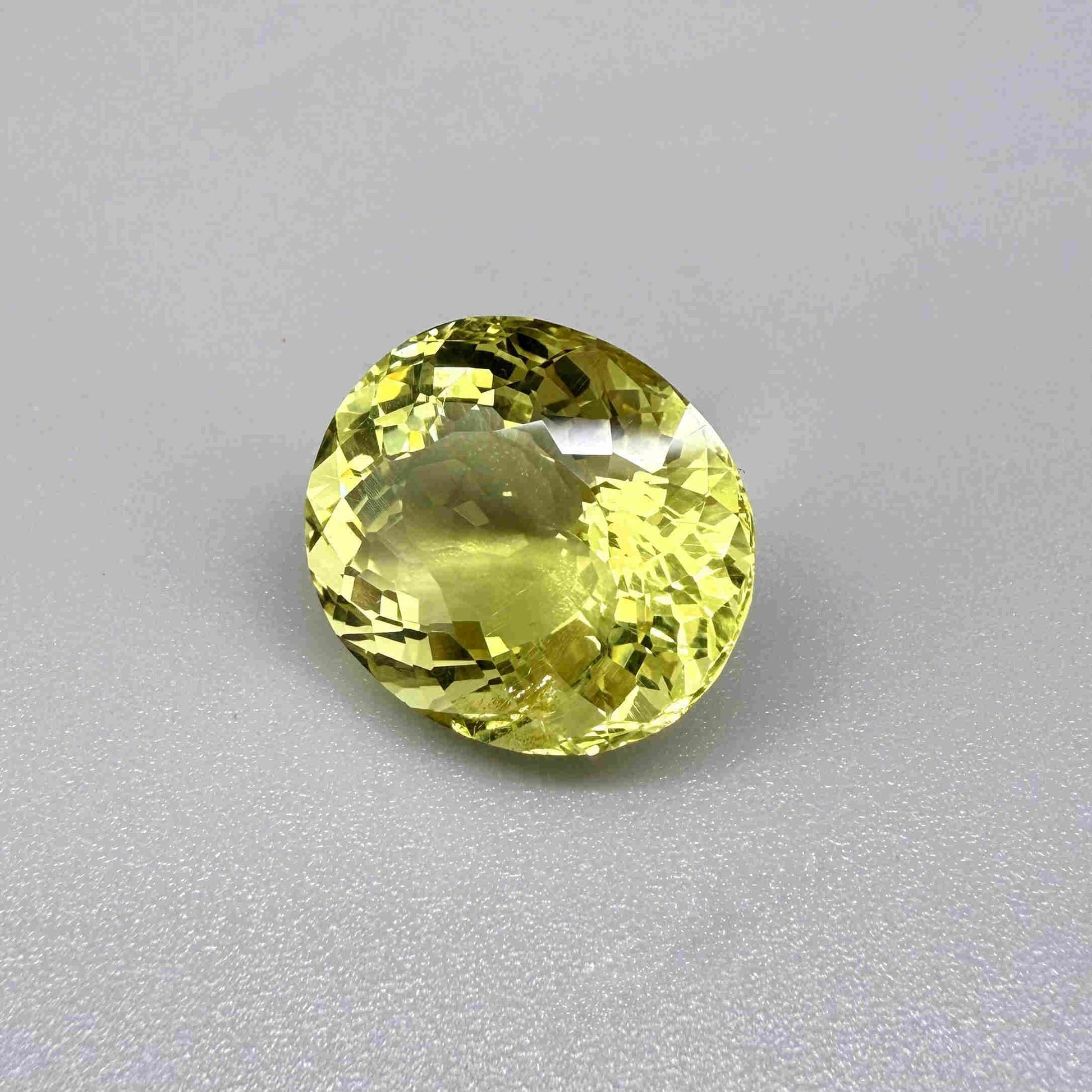 16.75 ct natural lemon quartz from Africa, oval cut with bright yellow color.