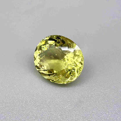 16.75 ct natural lemon quartz from Africa, oval cut with bright yellow color.