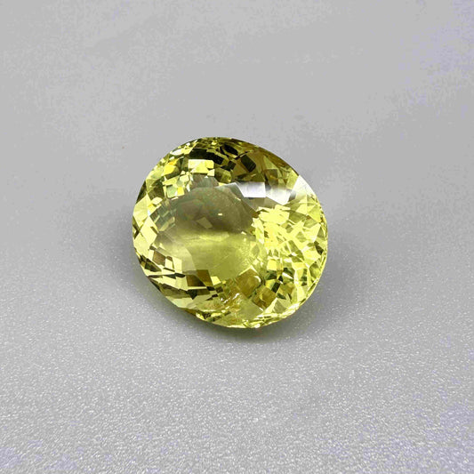 16.75 ct natural lemon quartz from Africa, oval cut with bright yellow color.