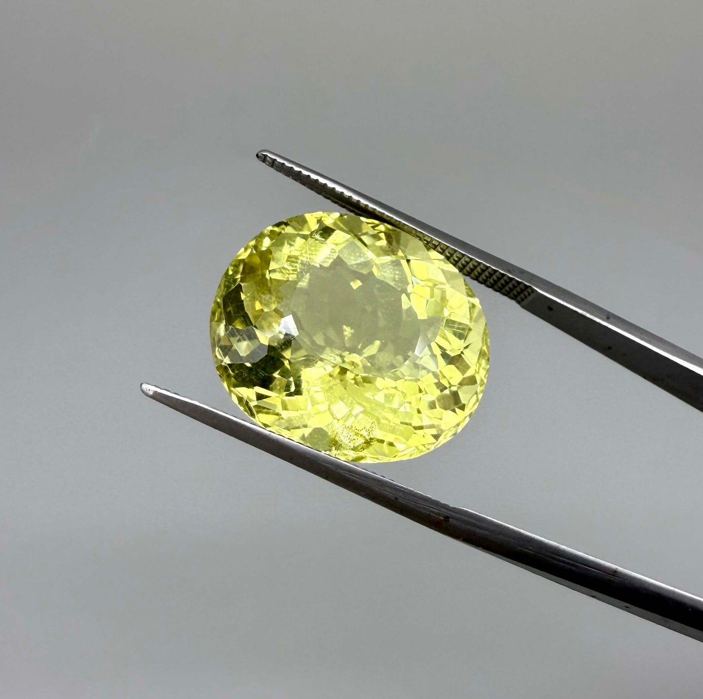 16.75 ct natural lemon quartz from Africa, oval cut with bright yellow color.