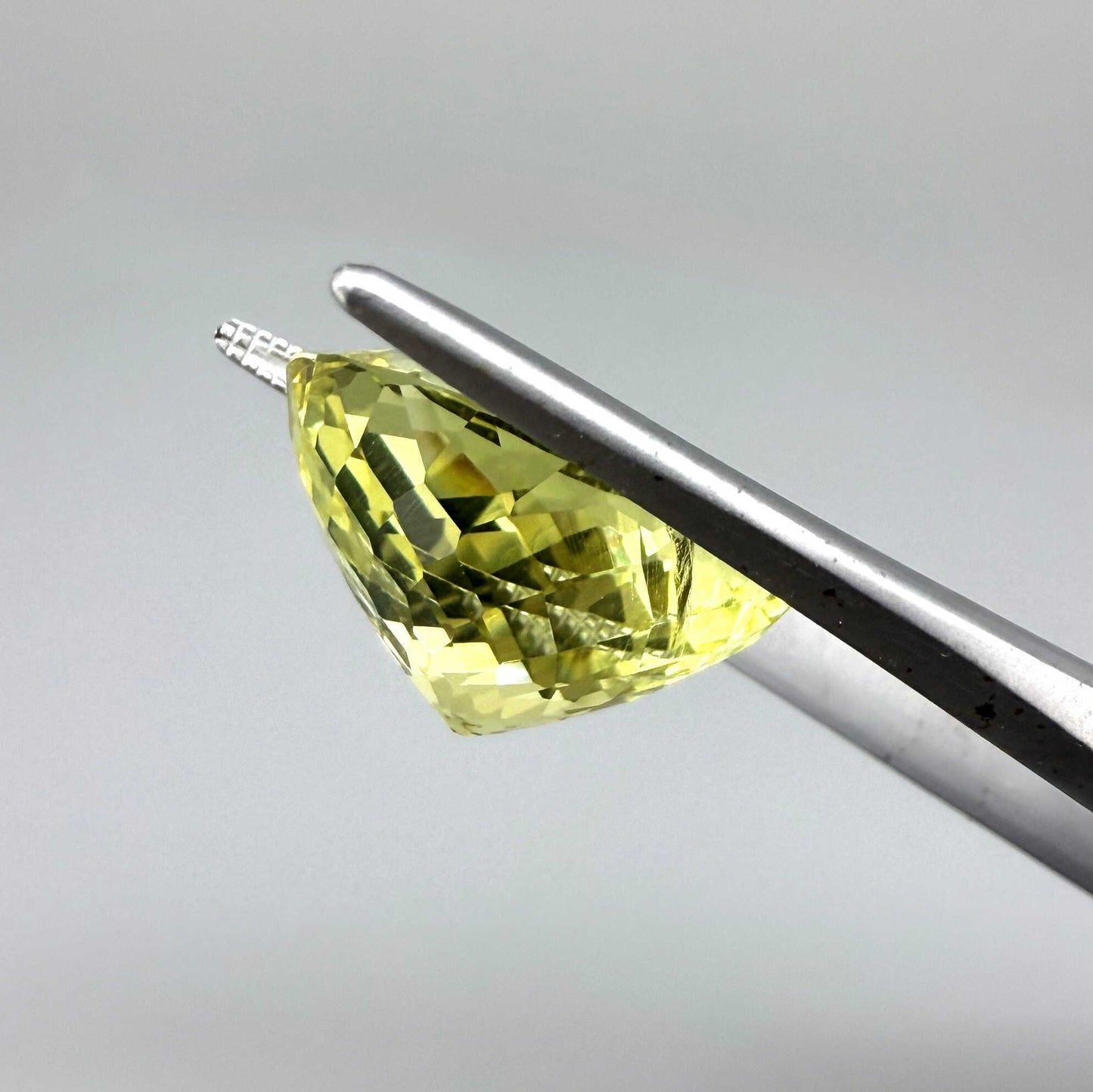 16.75 ct natural lemon quartz from Africa, oval cut with bright yellow color.