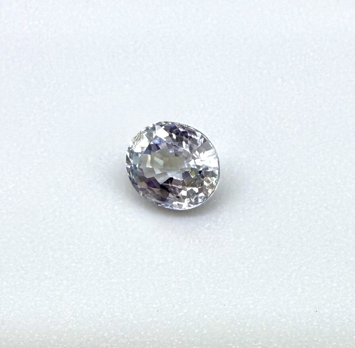 0.54 ct natural pale purplish-blue sapphire, oval cut.