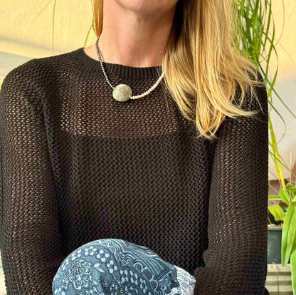 Hematite and cultured pearl necklace, 44 cm / 17.3 in long, featuring a large metallic centerpiece and contrasting light-dark design.