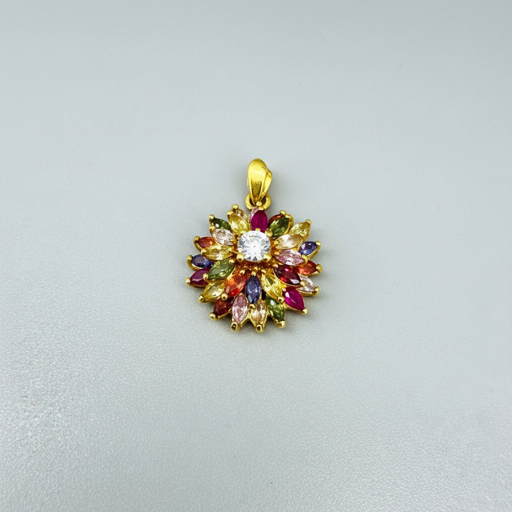 Gold-plated silver pendant with natural fancy sapphires and a central ruby in a floral arrangement.