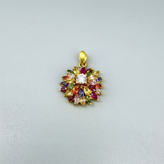 Gold-plated silver pendant with natural fancy sapphires and a central ruby in a floral arrangement.