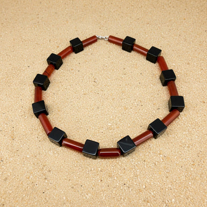 Handcrafted red agate and black cube-bead necklace, geometric design, 43 cm.