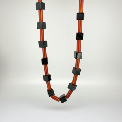 Handcrafted red agate and black cube-bead necklace, geometric design, 43 cm.