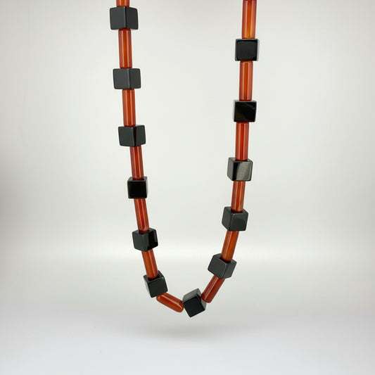Handcrafted red agate and black cube-bead necklace, geometric design, 43 cm.