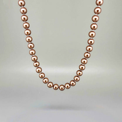 Rose-gold imitation pearl necklace, 45 cm / 17.7 in, featuring round polished beads with a refined luster.