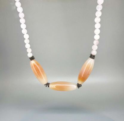 Rose quartz necklace and bracelet set, featuring soft pink beads with peach-toned accent stones, necklace 46 cm / 18.1 in, bracelet 17 cm / 6.7 in.