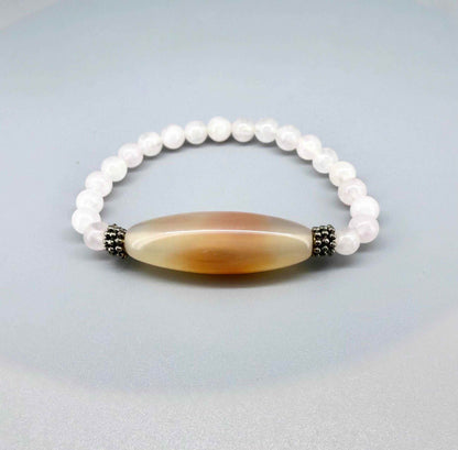 Rose quartz necklace and bracelet set, featuring soft pink beads with peach-toned accent stones, necklace 46 cm / 18.1 in, bracelet 17 cm / 6.7 in.