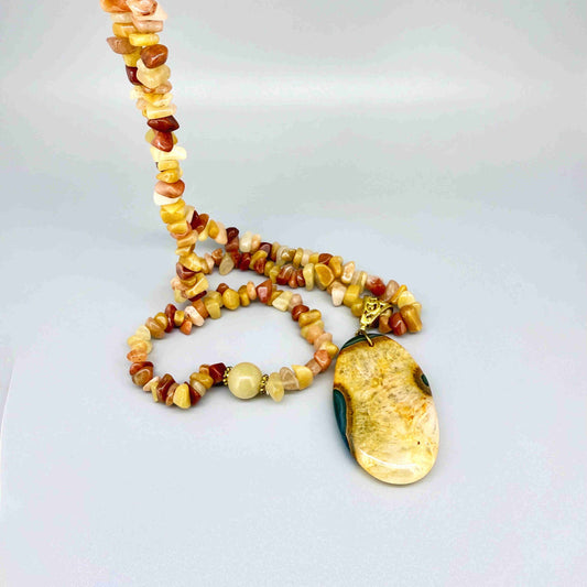 Handmade jade and agate beaded necklace and bracelet set in yellow, amber, and honey tones with polished jade pendant.