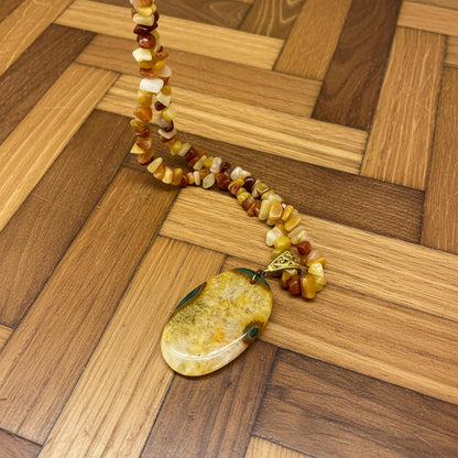Handmade jade and agate beaded necklace and bracelet set in yellow, amber, and honey tones with polished jade pendant.