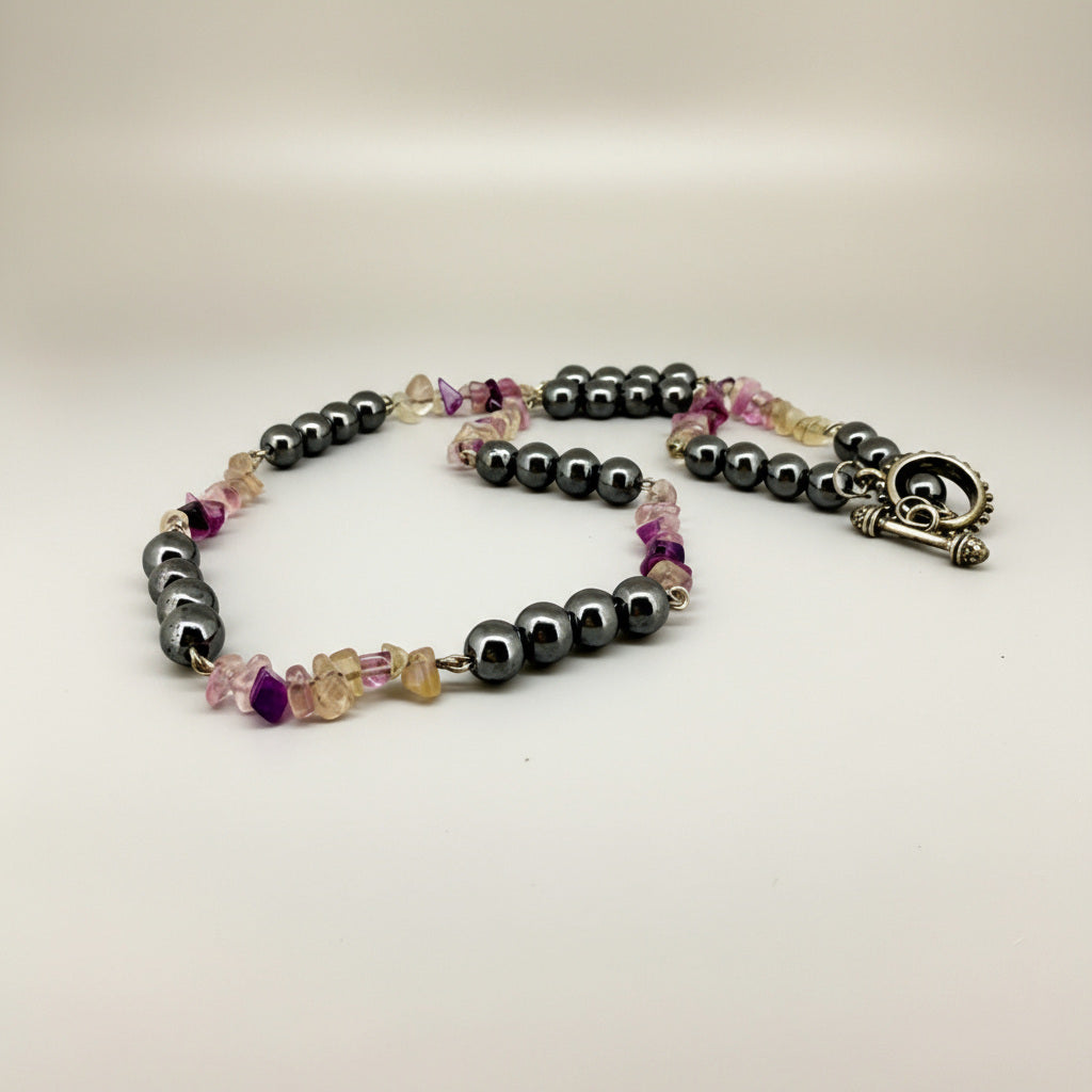 Handcrafted hematite and fluorite necklace in metallic silver-grey with pastel accents, 50 cm.