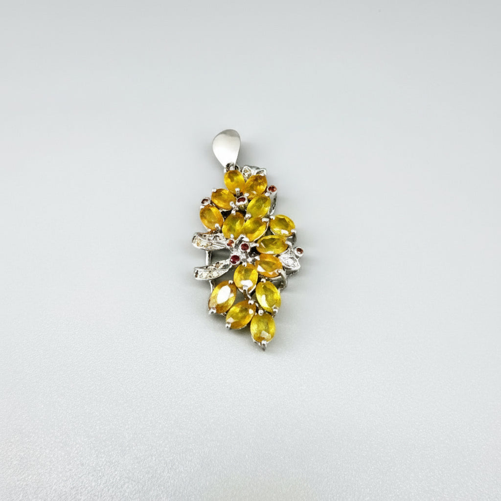 Handcrafted pendant with 9.46 ct orange and yellow fancy sapphires set in white-gold-plated sterling silver.