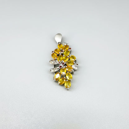 Handcrafted pendant with 9.46 ct orange and yellow fancy sapphires set in white-gold-plated sterling silver.