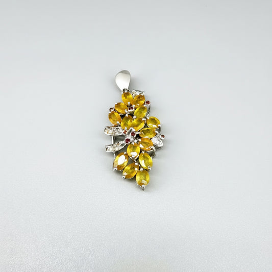 Handcrafted pendant with 9.46 ct orange and yellow fancy sapphires set in white-gold-plated sterling silver.