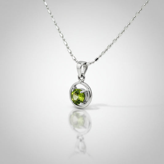 White-gold-plated silver pendant featuring a 1.36 ct natural peridot in a polished modern setting.