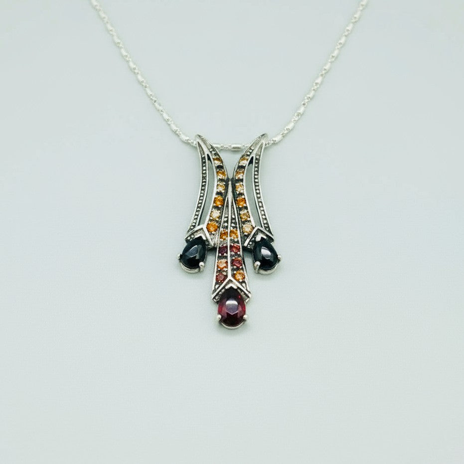 White Gold plated Silver Pendant with Garnets & Fancy Sapphires