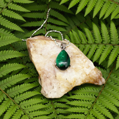 Sterling silver pendant featuring a 6.38 ct natural malachite with deep green banding.