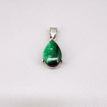 Sterling silver pendant featuring a 6.38 ct natural malachite with deep green banding.