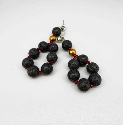 Handcrafted lava stone jewelry set with necklace, bracelet, and earrings in matte black and brown tones.