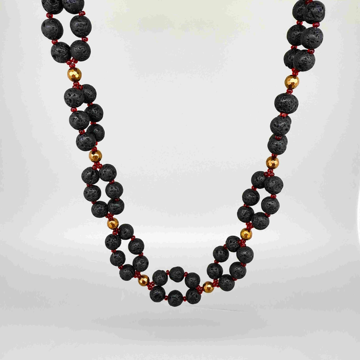 Handcrafted lava stone jewelry set with necklace, bracelet, and earrings in matte black and brown tones.