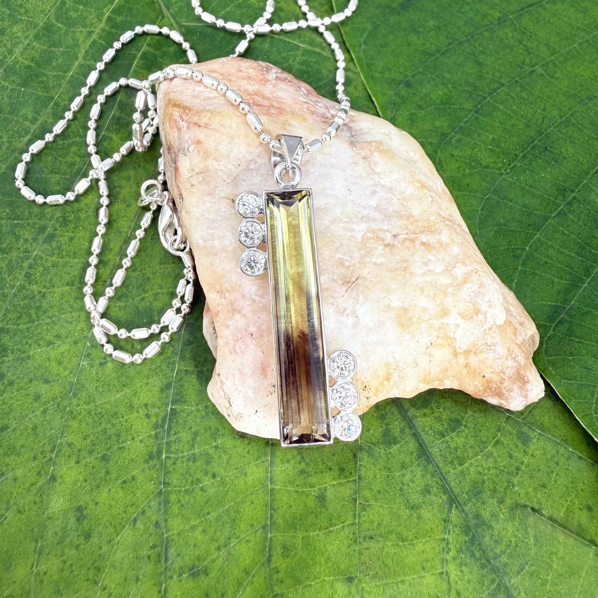 Handmade bicolor lemon quartz pendant in white-gold-plated silver, 6.42ct, with CZ accents. Yellow-to-honey tones, elegant and unique.