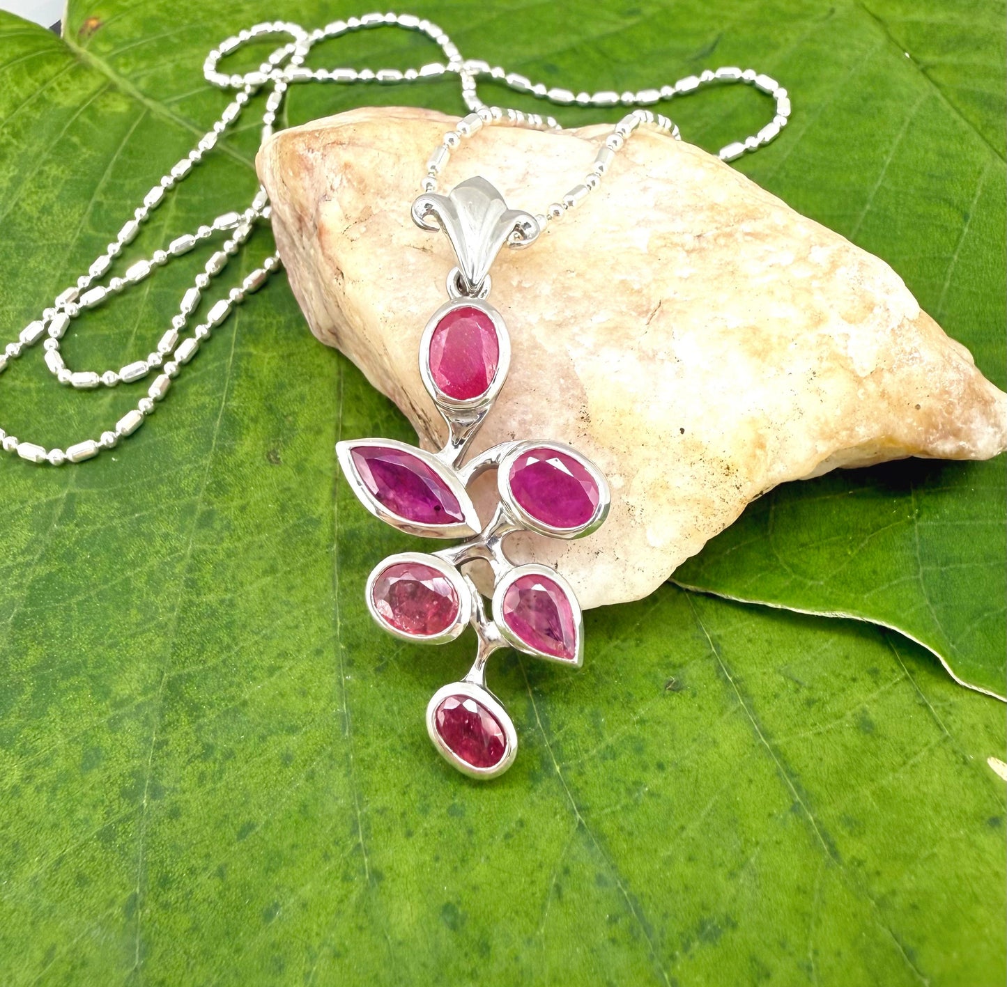 White Gold plated Silver Pendant with Pink Rubies