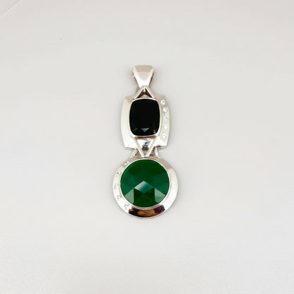 Handcrafted white-gold-plated silver pendant with two green chalcedony stones (16.47 ct total) in a modern geometric design.