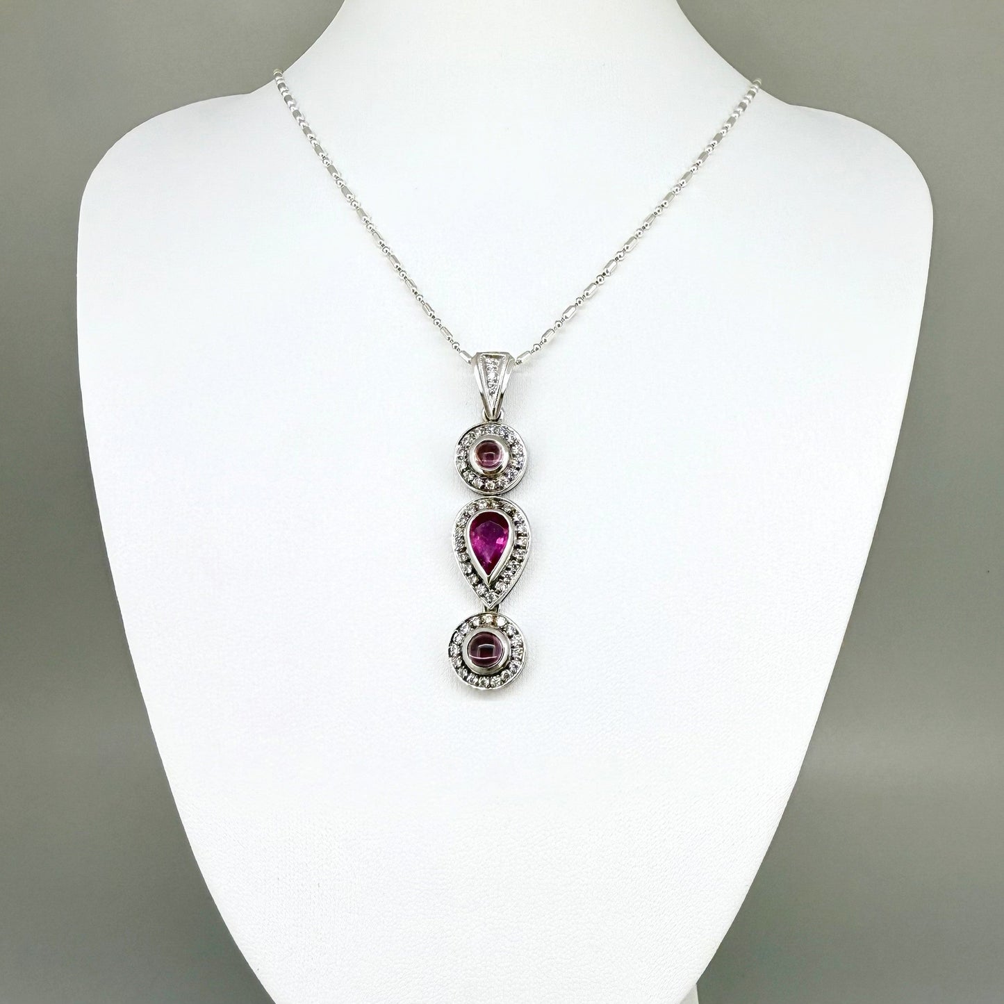 Handmade pendant featuring a 2.12 ct natural green tourmaline with cubic zirconia accents, set in white-gold-plated sterling silver.