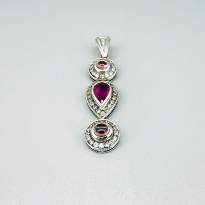 Handmade pendant featuring a 2.12 ct natural green tourmaline with cubic zirconia accents, set in white-gold-plated sterling silver.