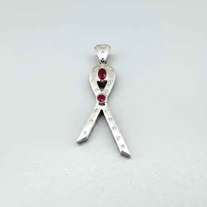 Modern handcrafted pendant in white-gold-plated silver with two natural rubies (1.73 ct total) and cubic zirconia accents.