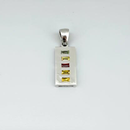 Handmade pendant featuring 0.8 ct fancy sapphires in yellow, pink, and blue, set in white-gold-plated sterling silver.