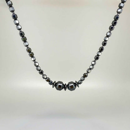 Hematite beaded necklace, 45 cm / 17.7 in long, with polished metallic grey stones and larger statement center beads.
