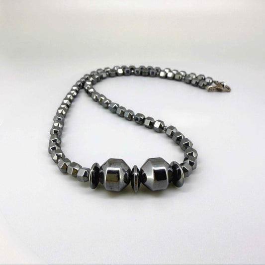 Hematite beaded necklace, 45 cm / 17.7 in long, with polished metallic grey stones and larger statement center beads.