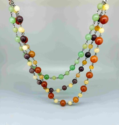 Double-strand necklace with jade and aventurine beads in green, yellow and brown tones, 70 cm.