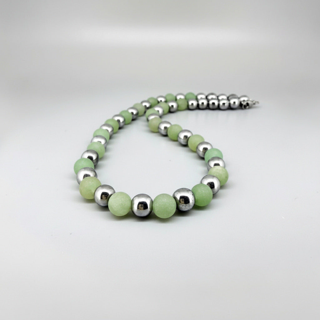 Handcrafted aventurine and hematite necklace in light green with metallic accents, 42 cm.
