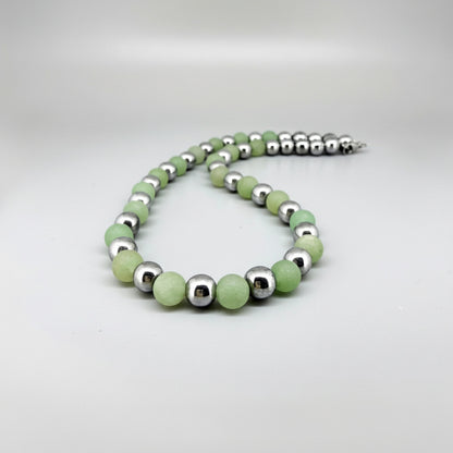 Handcrafted aventurine and hematite necklace in light green with metallic accents, 42 cm.